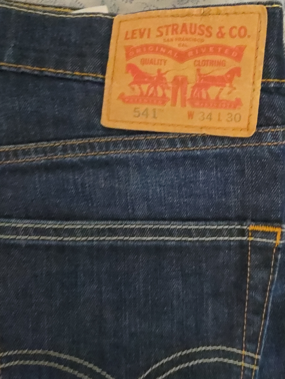 Levi's Slim Straight Jeans in Dark Indigo with Tan Patch